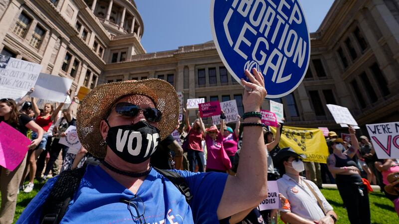 FILE - Abortion rights demonstrators attend a rally at the Texas state Capitol in Austin,...
