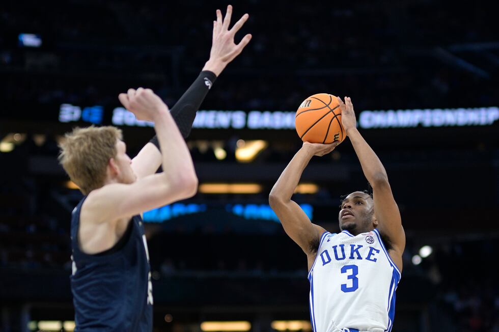 Duke guard Jeremy Roach (3) shoots as Oral Roberts forward Connor Vanover, left, defends...