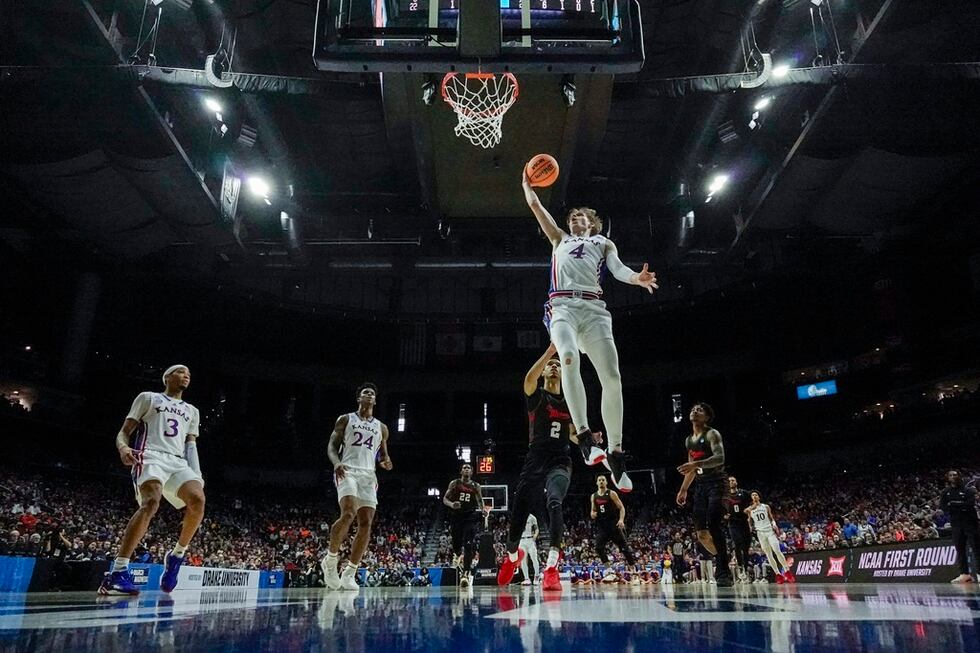 Kansas's Gradey Dick shoots past Howard's Steve Settle III during first half of a first-round...