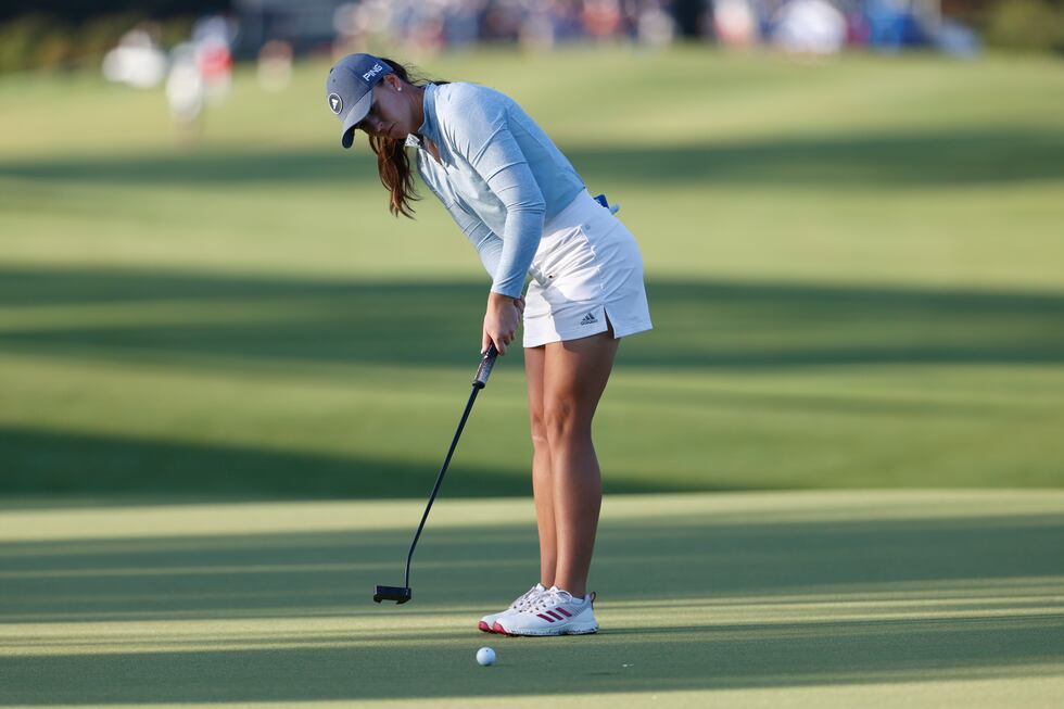 Linn Grant putts on the first green during the first round of an LPGA golf tournament...